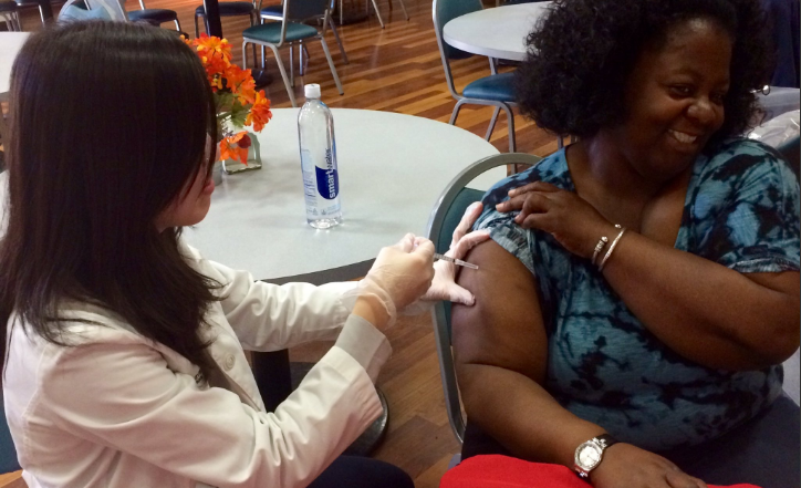 Baltimore City Health Department staff give free flu shots at Election Polls in Baltimore City